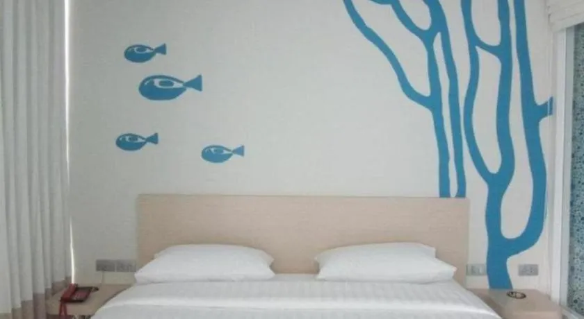 Bed in R-Con Blue Ocean Hotel