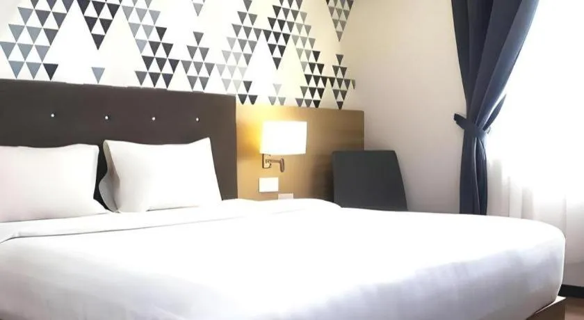 Bed in Orchardz Hotel Gajah Mada