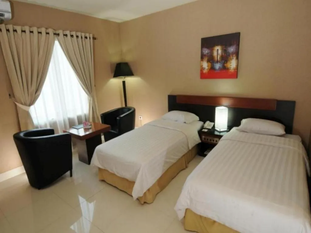 Bed in Orchardz Hotel Gajah Mada
