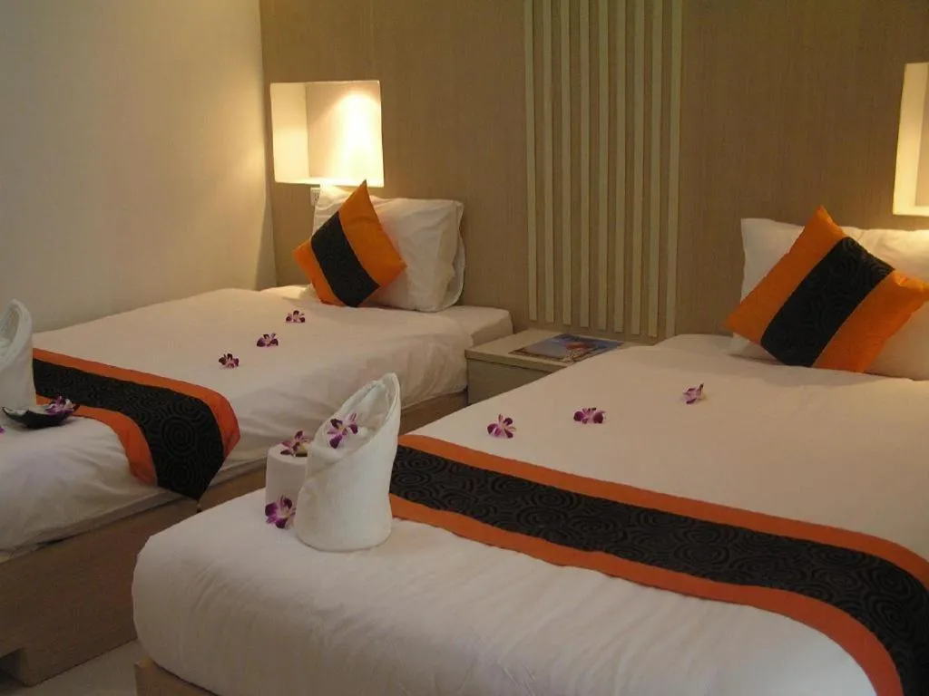 Bed in The Impress Khonkaen Hotel