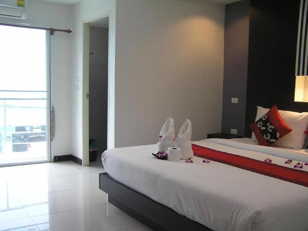 Bed in The Impress Khonkaen Hotel