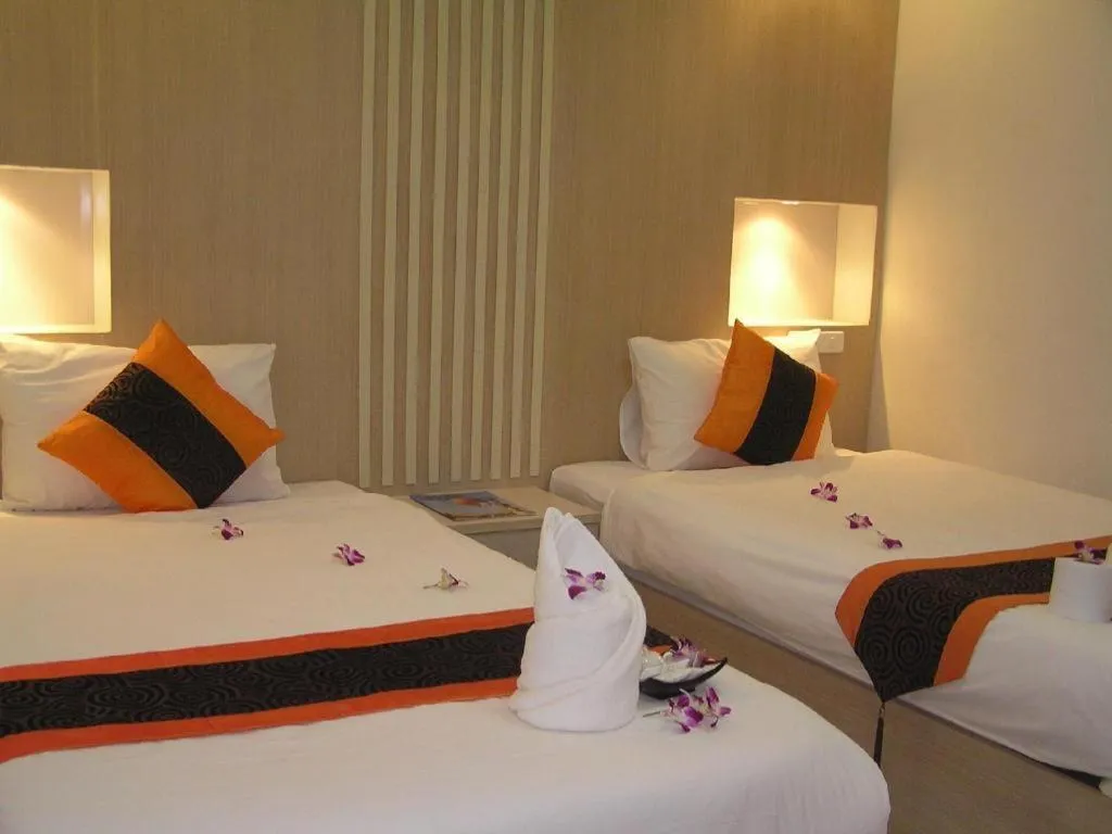 Bed in The Impress Khonkaen Hotel