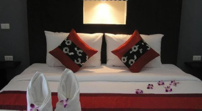 Bed in The Impress Khonkaen Hotel