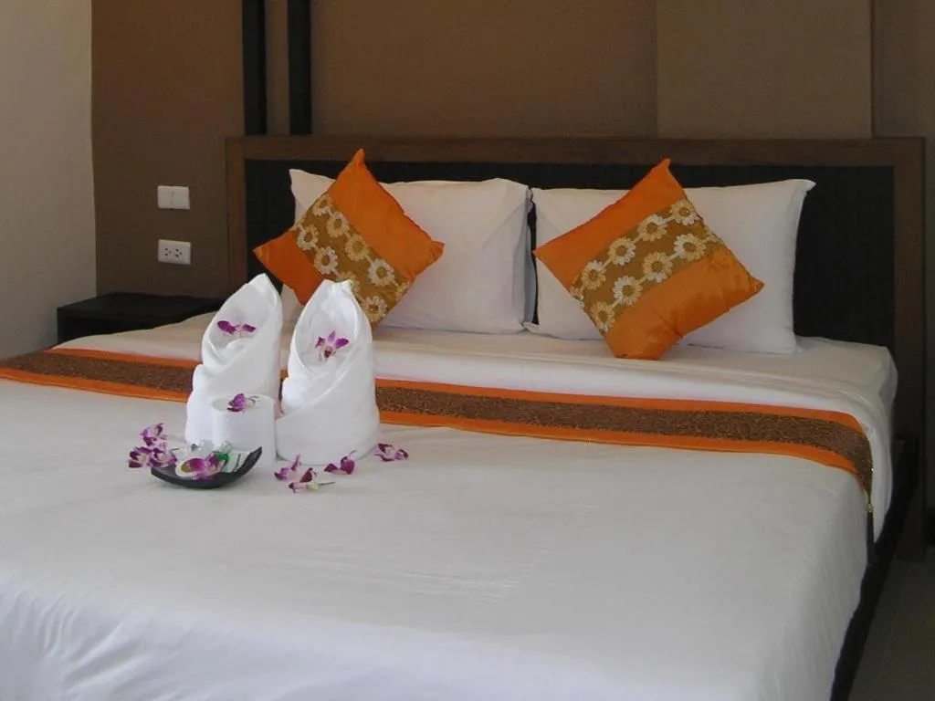 Bed in The Impress Khonkaen Hotel