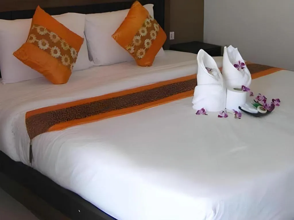 Bed in The Impress Khonkaen Hotel