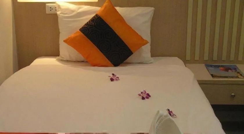 Bed in The Impress Khonkaen Hotel