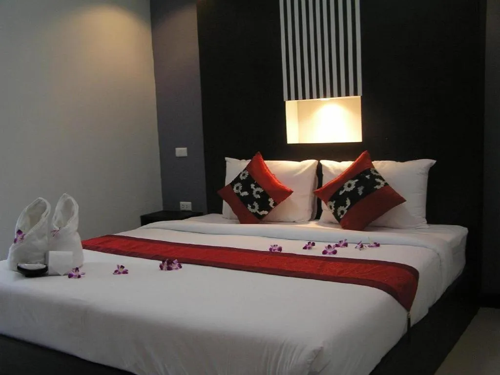 Bed in The Impress Khonkaen Hotel