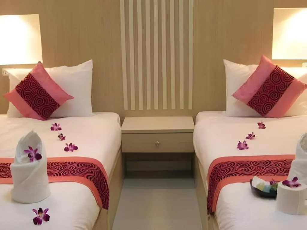 Bed in The Impress Khonkaen Hotel