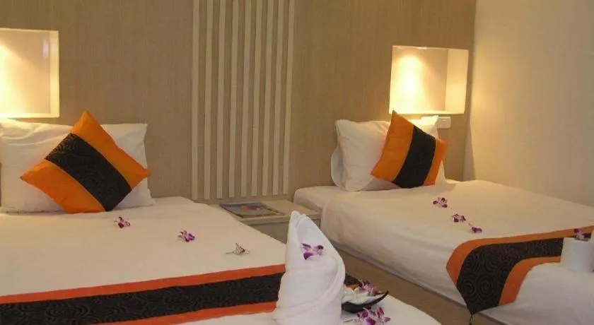 Bed in The Impress Khonkaen Hotel