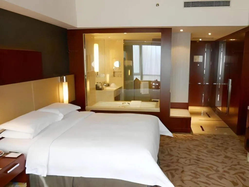 Bed in Kun Tai Glory Hotel Beijing Wangjing