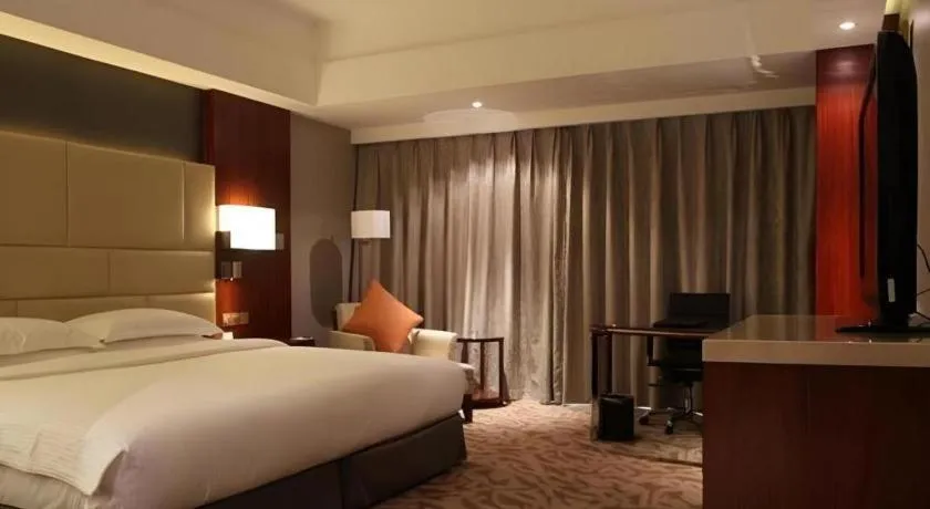 Bed in Kun Tai Glory Hotel Beijing Wangjing