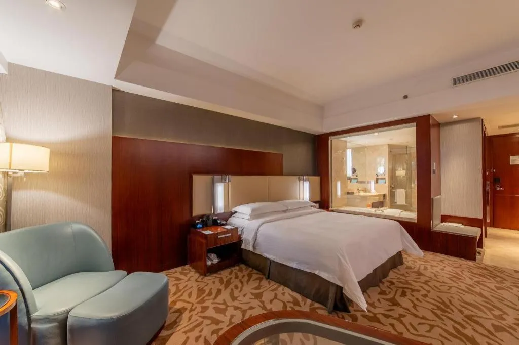 Bed in Kun Tai Glory Hotel Beijing Wangjing