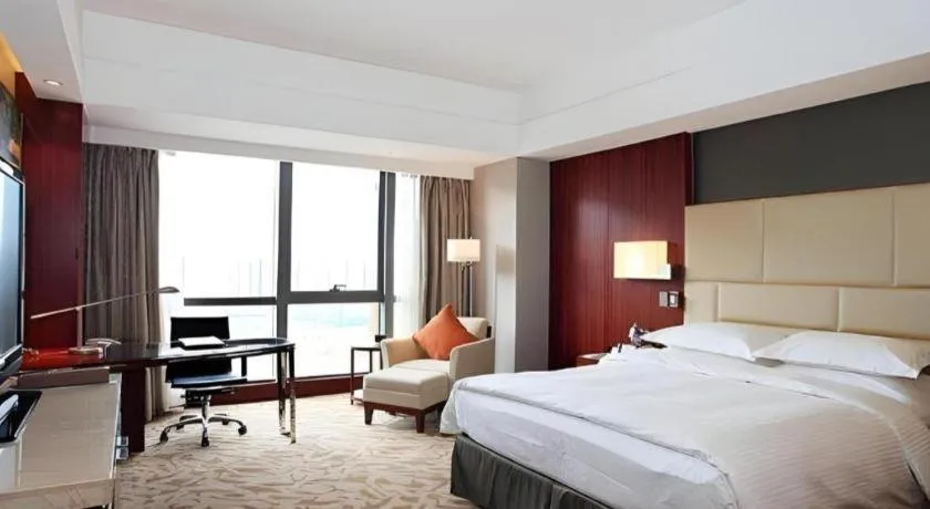 Bed in Kun Tai Glory Hotel Beijing Wangjing