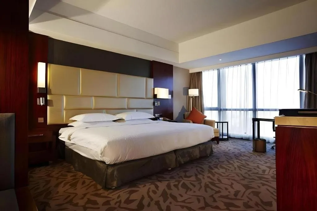 Bed in Kun Tai Glory Hotel Beijing Wangjing