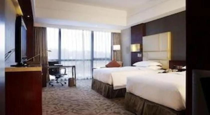 Bed in Kun Tai Glory Hotel Beijing Wangjing