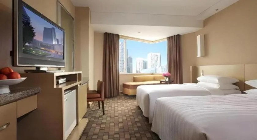 Bed in Kun Tai Glory Hotel Beijing Wangjing