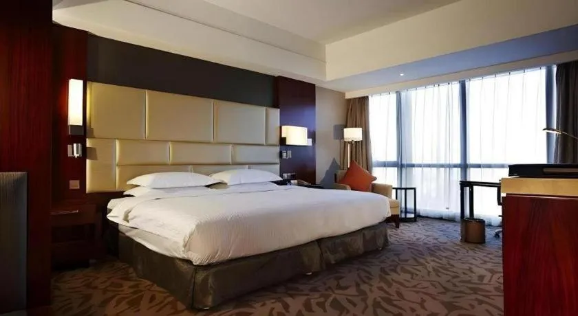 Bed in Kun Tai Glory Hotel Beijing Wangjing