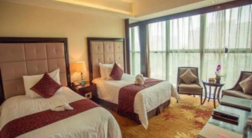 Bed in New Century Grand Hotel Xinxiang