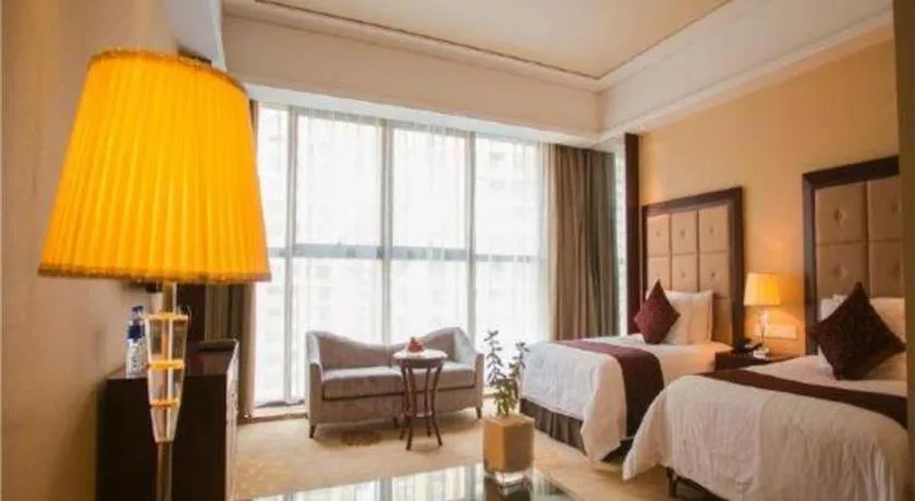 Bed in New Century Grand Hotel Xinxiang