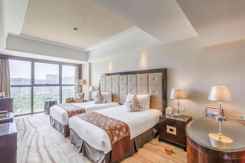 Bed in New Century Grand Hotel Xinxiang