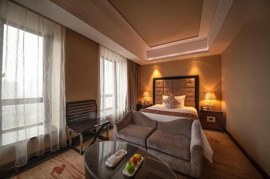 Bed in New Century Grand Hotel Xinxiang