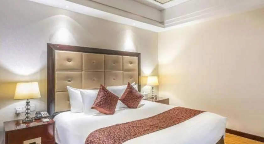 Bed in New Century Grand Hotel Xinxiang