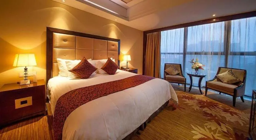 Bed in New Century Grand Hotel Xinxiang