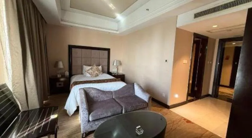 Bed in New Century Grand Hotel Xinxiang