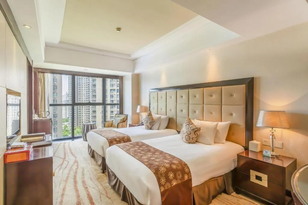 Bed in New Century Grand Hotel Xinxiang