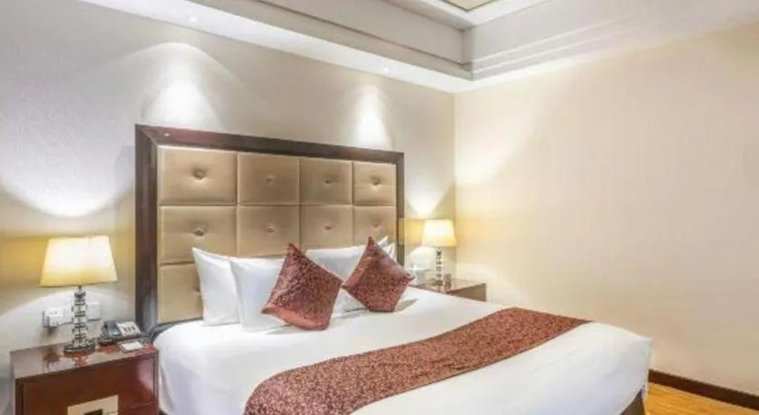 Bed in New Century Grand Hotel Xinxiang