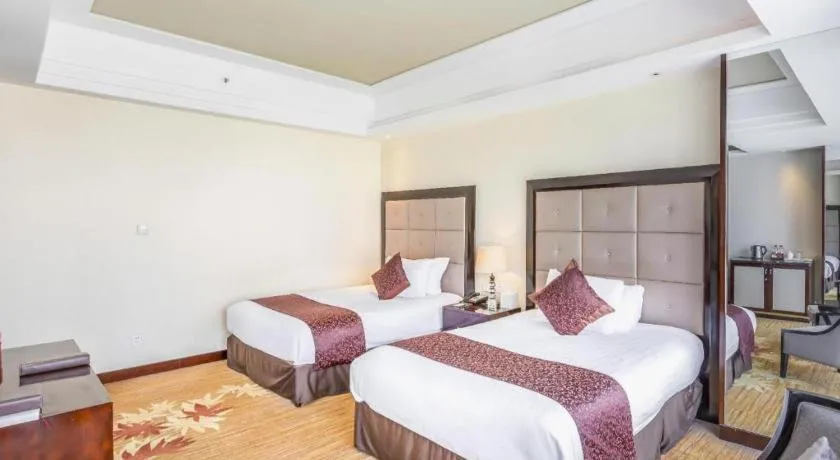 Bed in New Century Grand Hotel Xinxiang