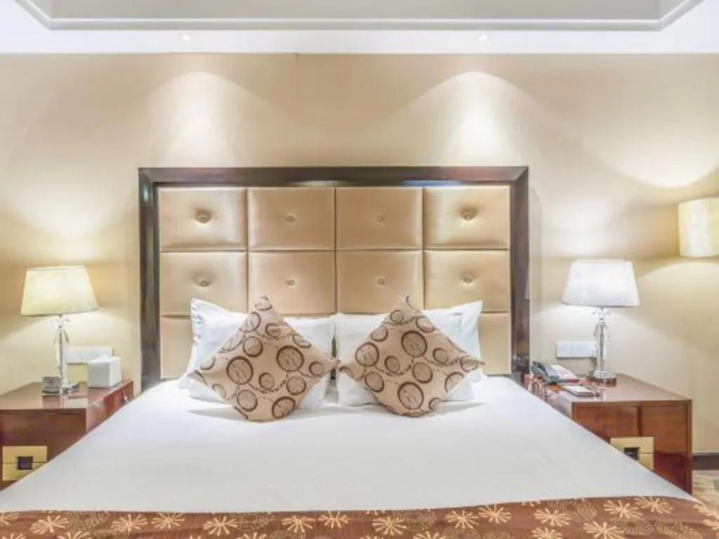 Bed in New Century Grand Hotel Xinxiang