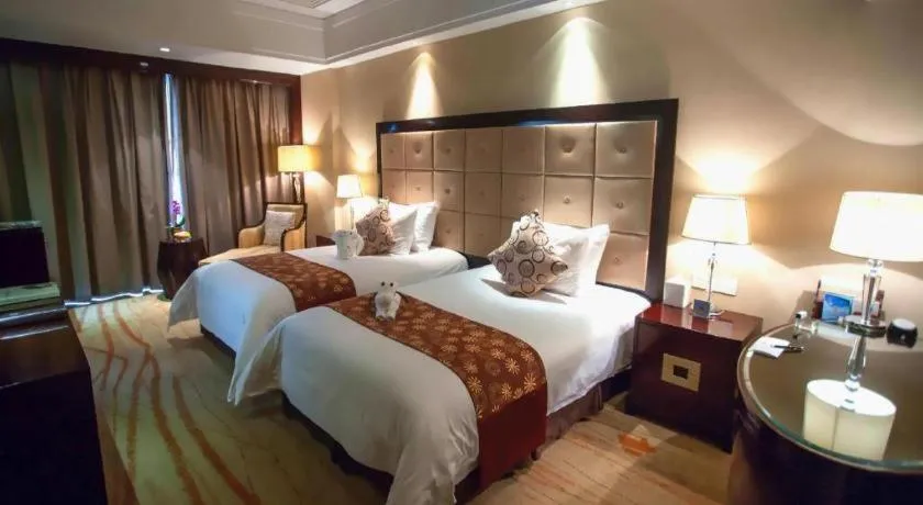 Bed in New Century Grand Hotel Xinxiang