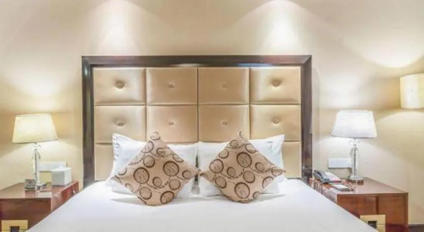 Bed in New Century Grand Hotel Xinxiang