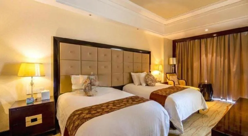 Bed in New Century Grand Hotel Xinxiang