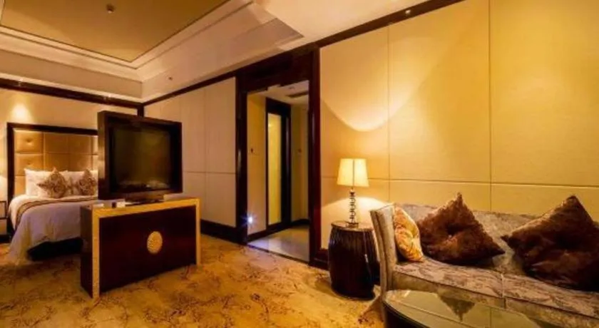 Bed in New Century Grand Hotel Xinxiang