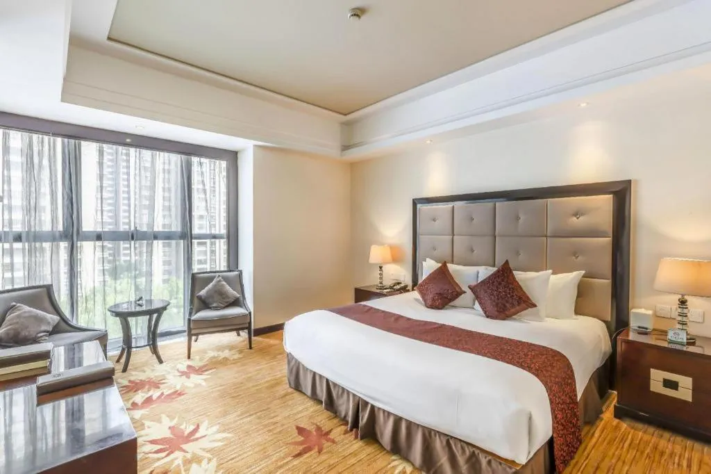 Bed in New Century Grand Hotel Xinxiang