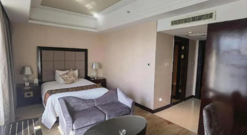 Bed in New Century Grand Hotel Xinxiang