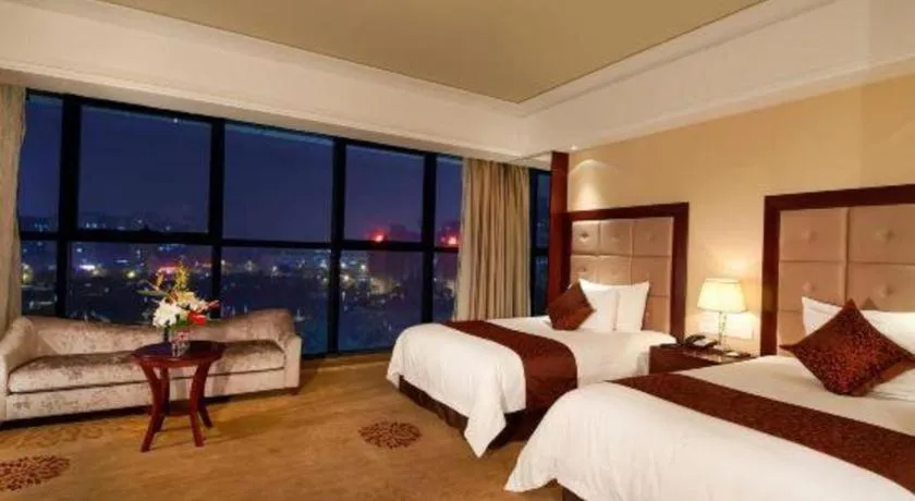 Bed in New Century Grand Hotel Xinxiang