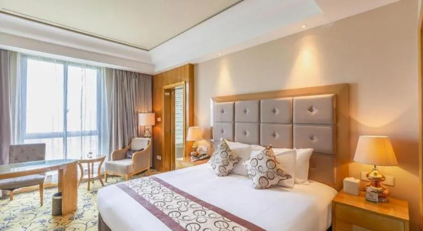 Bed in New Century Grand Hotel Xinxiang