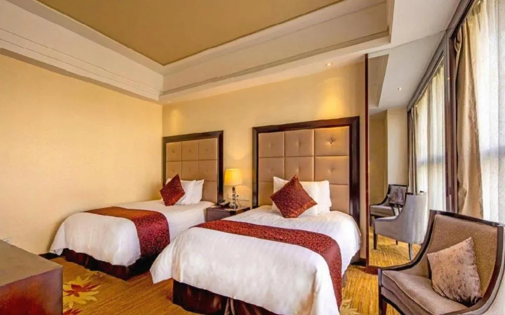 Bed in New Century Grand Hotel Xinxiang