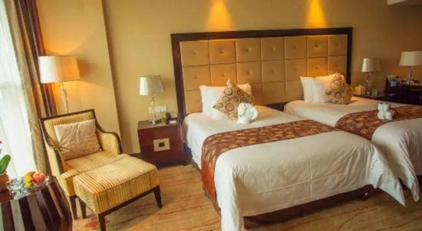 Bed in New Century Grand Hotel Xinxiang