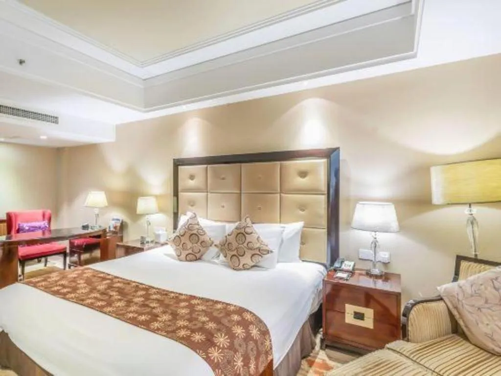 Bed in New Century Grand Hotel Xinxiang