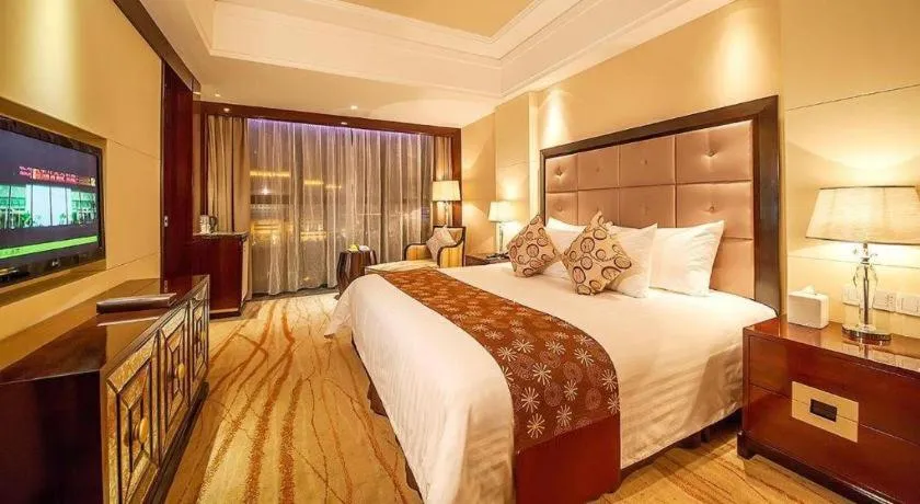 Bed in New Century Grand Hotel Xinxiang