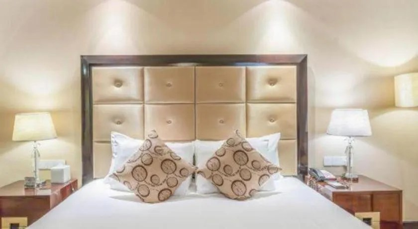 Bed in New Century Grand Hotel Xinxiang