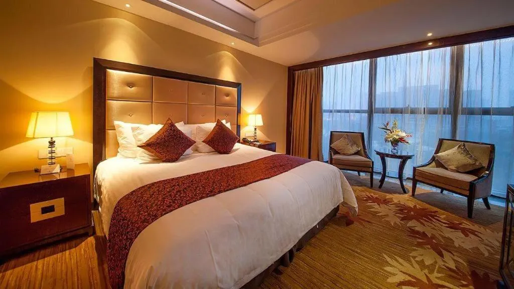 Bed in New Century Grand Hotel Xinxiang