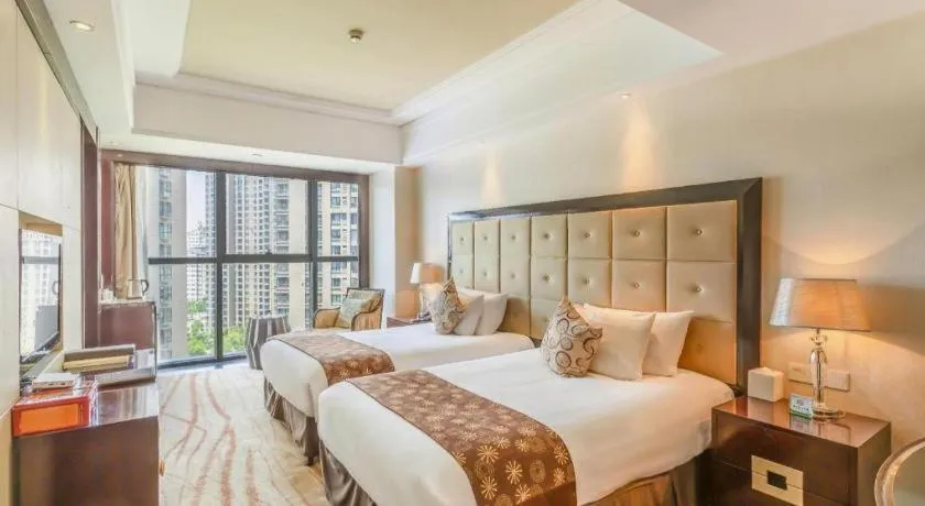 Bed in New Century Grand Hotel Xinxiang