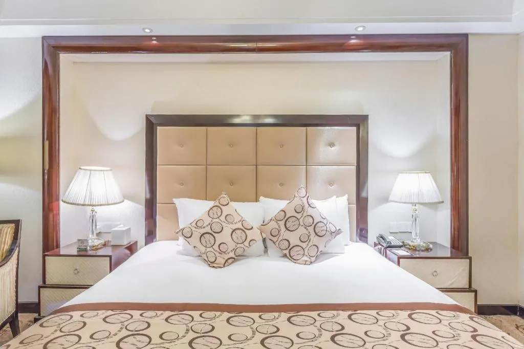 Bed in New Century Grand Hotel Xinxiang