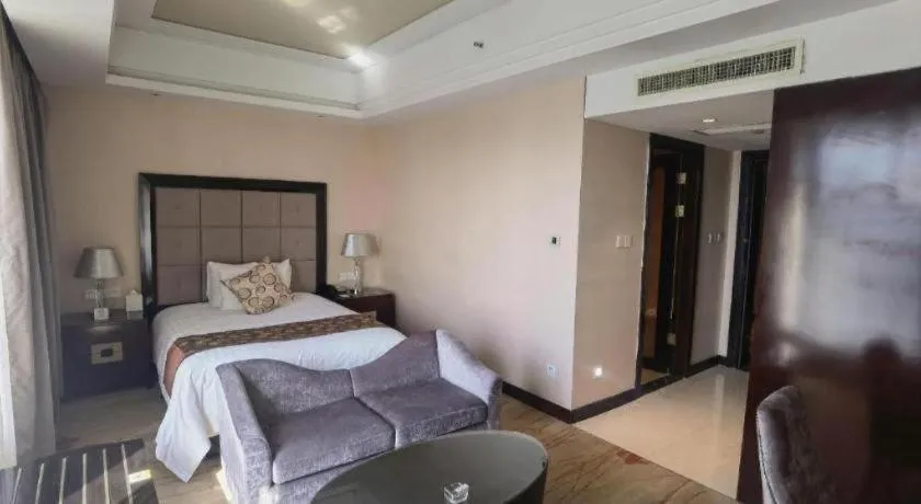 Bed in New Century Grand Hotel Xinxiang