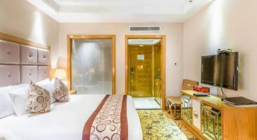 Bed in New Century Grand Hotel Xinxiang